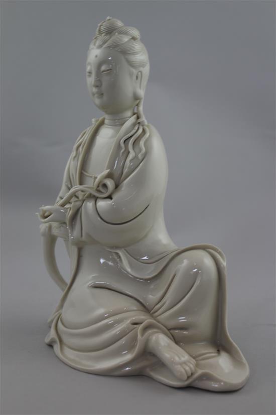 A Chinese blanc de chine seated figure of Guanyin, 20th century, 20.5cm